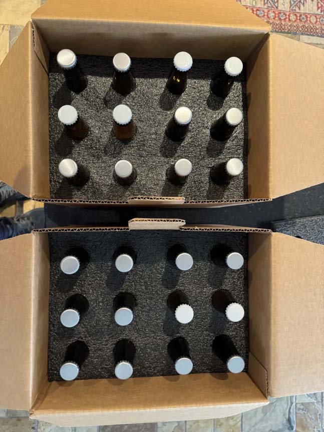 Placing bottles in foam slots
