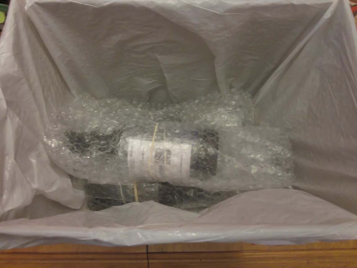 Placing wrapped bottles into box